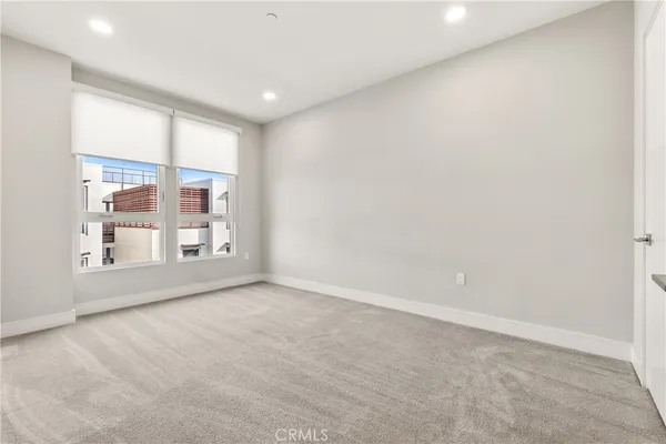 a room with gym equipment and large window