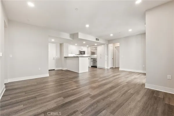 a kitchen with a refrigerator and a sink