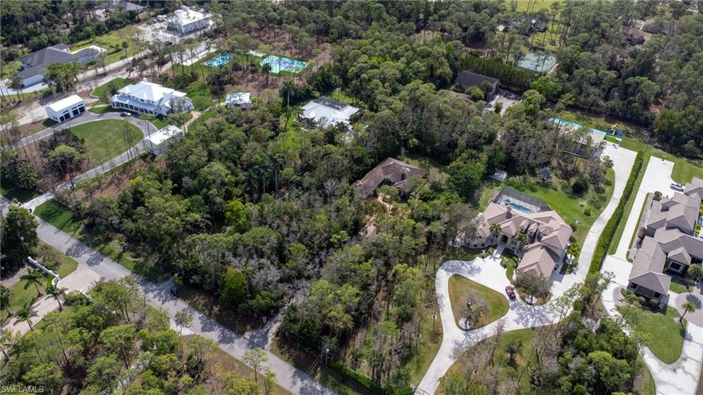 6800 Hunters Road Naples, FL 34109 - Photo 13 of 16 an aerial view of a house with a yard and outdoor seating