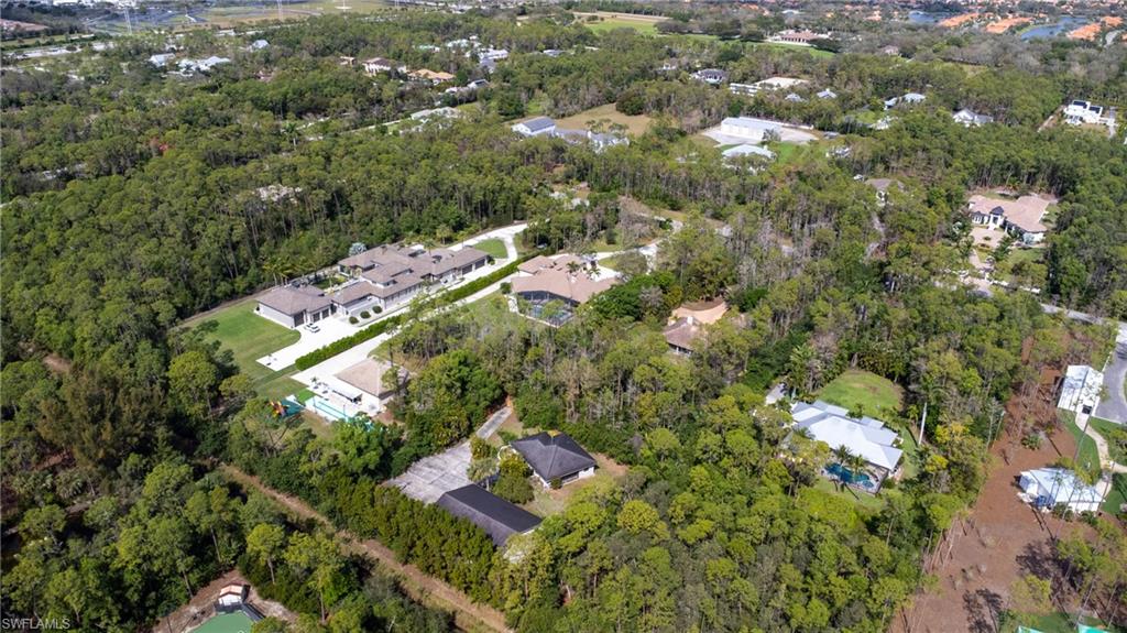 6800 Hunters Road Naples, FL 34109 - Photo 14 of 16 an aerial view of residential houses with outdoor space