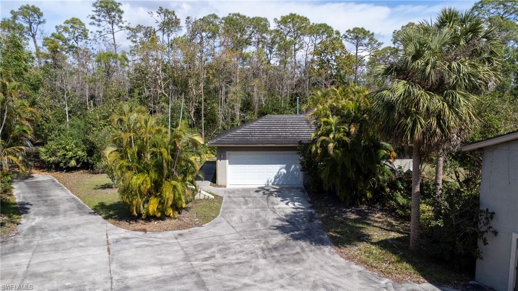 6800 Hunters Road Naples, FL 34109 - Photo 7 of 16 a view of a house with a yard