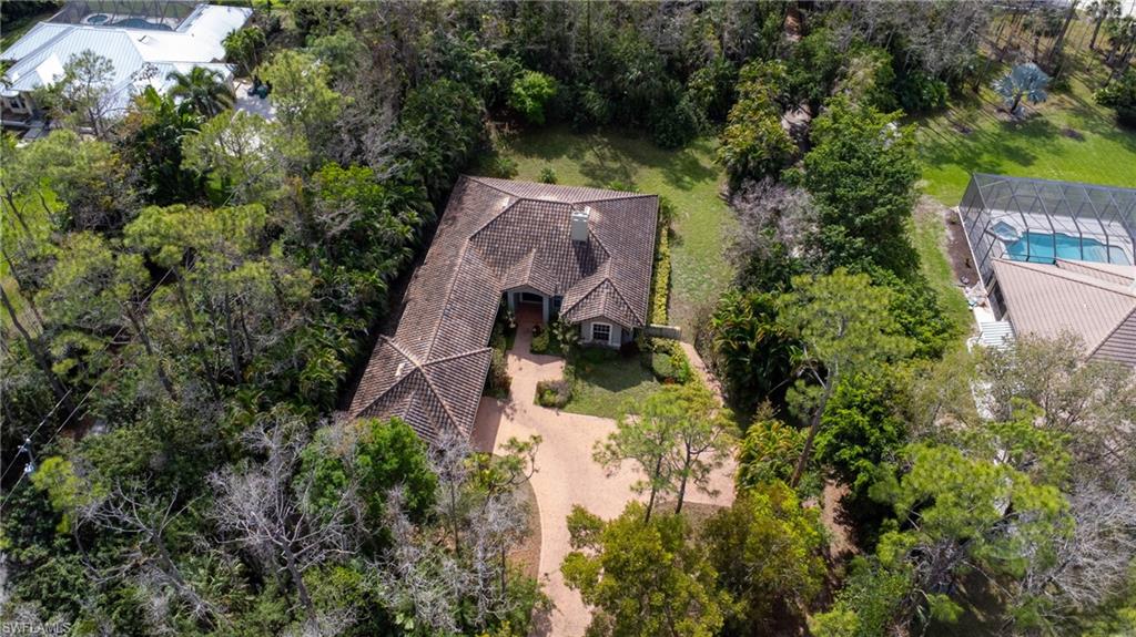 6800 Hunters Road Naples, FL 34109 - Photo 8 of 16 an aerial view of a house with a yard basket ball court and outdoor seating