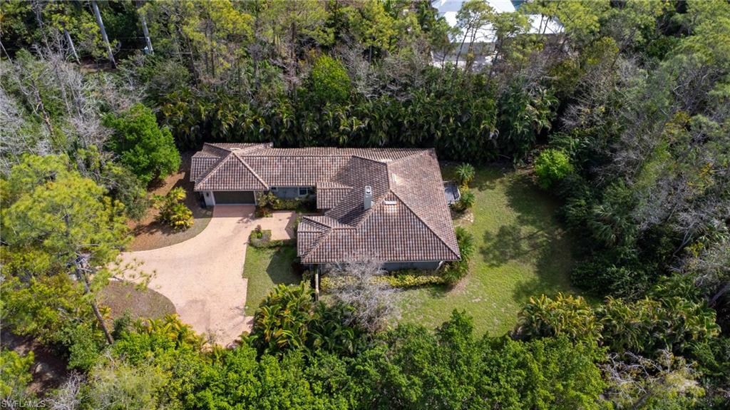 6800 Hunters Road Naples, FL 34109 - Photo 9 of 16 an aerial view of a house with yard and outdoor space