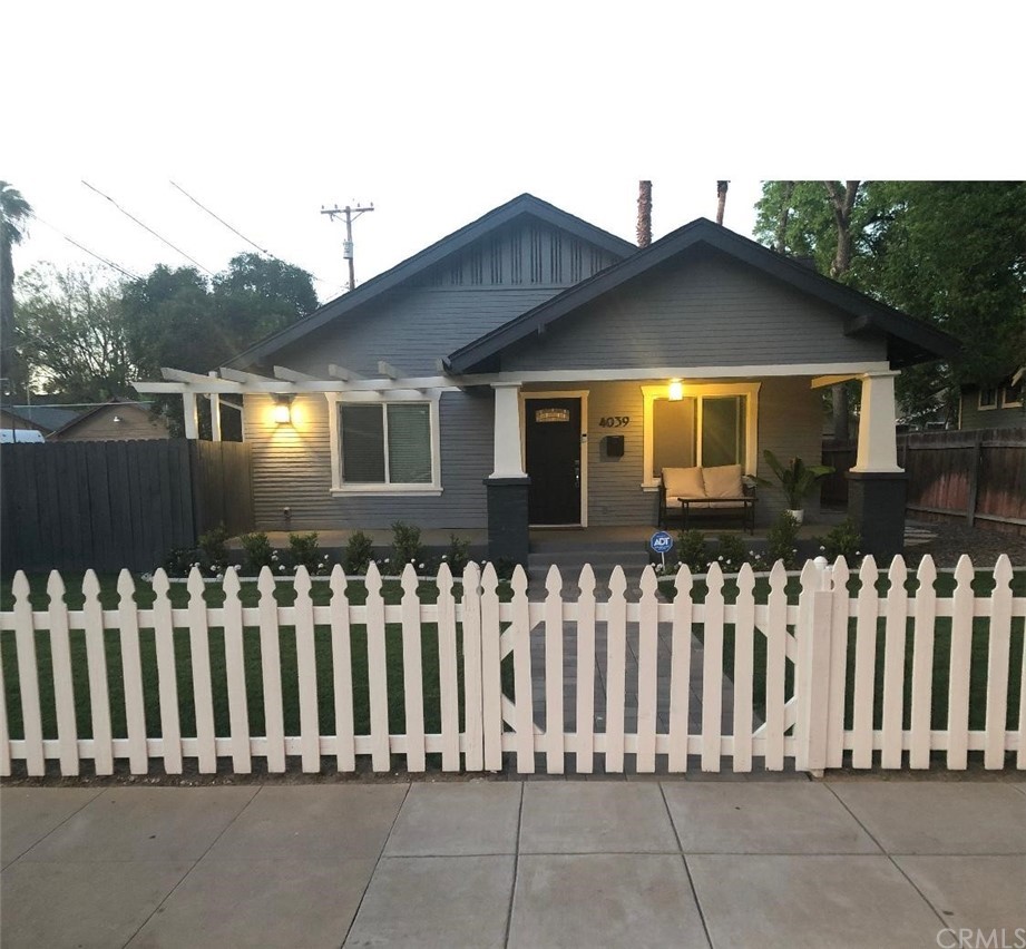4039 4th Street Riverside, CA 92501 - Photo 1 of 1 a front view of a house with wooden fence