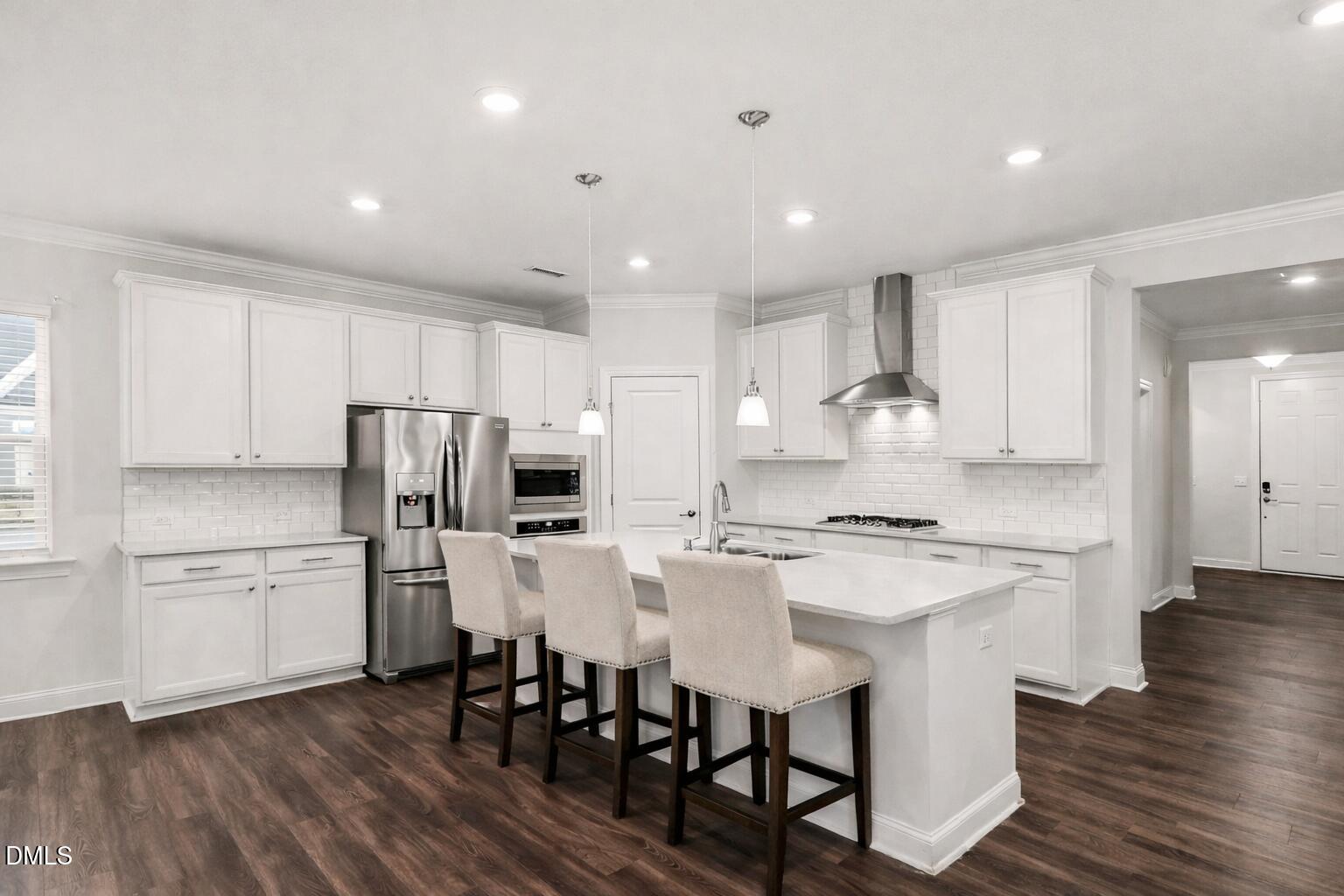 100 Ivory Lane Raleigh, NC 27610 - Photo 8 of 18 Modern kitchen with white island
