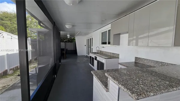 a view of a dining room with furniture window and outside view