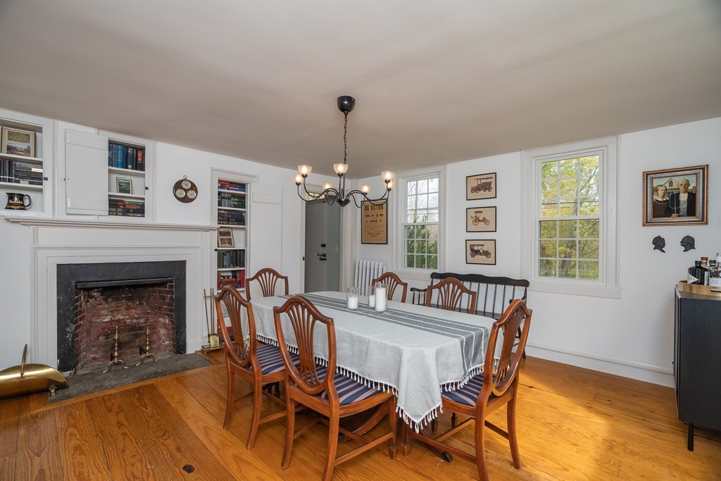 324 Chapin Road Hampden, MA 01036 - Photo 18 of 42 a dining room with furniture a fireplace and wooden floor