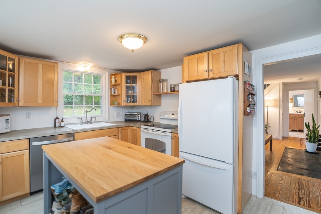 324 Chapin Road Hampden, MA 01036 - Photo 23 of 42 a white refrigerator freezer sitting inside of a kitchen