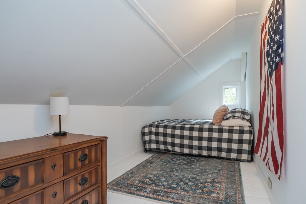 324 Chapin Road Hampden, MA 01036 - Photo 36 of 42 a bedroom with a bed and a lamp on dresser