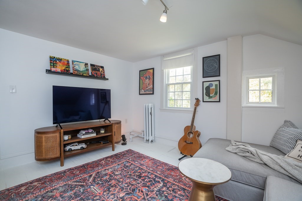 324 Chapin Road Hampden, MA 01036 - Photo 42 of 42 a living room with furniture and a flat screen tv