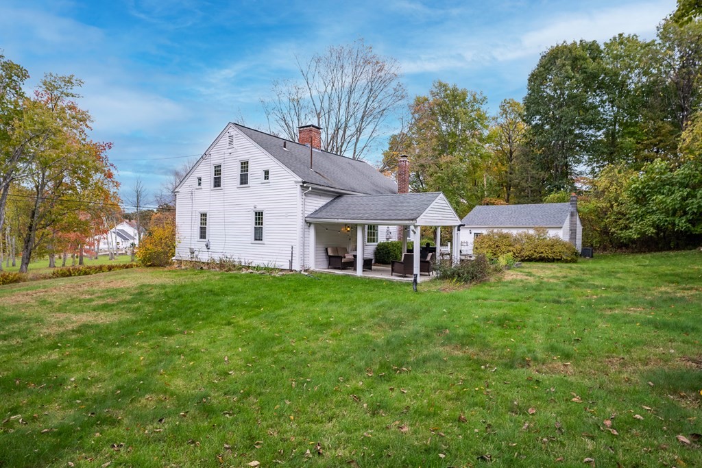 324 Chapin Road Hampden, MA 01036 - Photo 7 of 42 a view of a house with a big yard potted plants and large tree