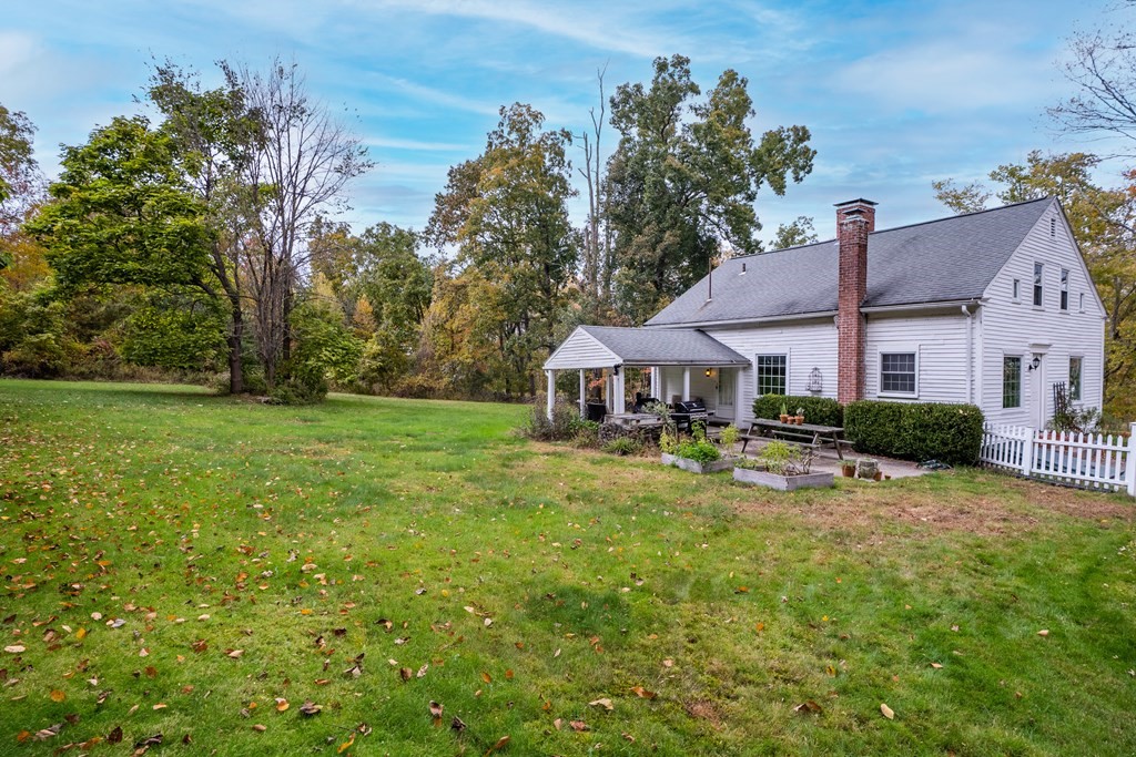 324 Chapin Road Hampden, MA 01036 - Photo 9 of 42 a view of a house with garden and a sitting area