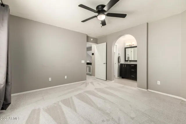 a view of a house with a tree in the background