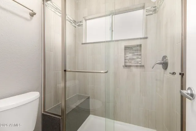 a view of a street with a building in the background