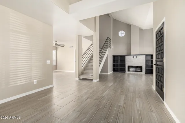 wooden floor in an empty room with a window