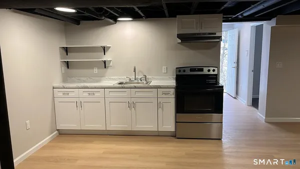 a kitchen with a sink and a refrigerator