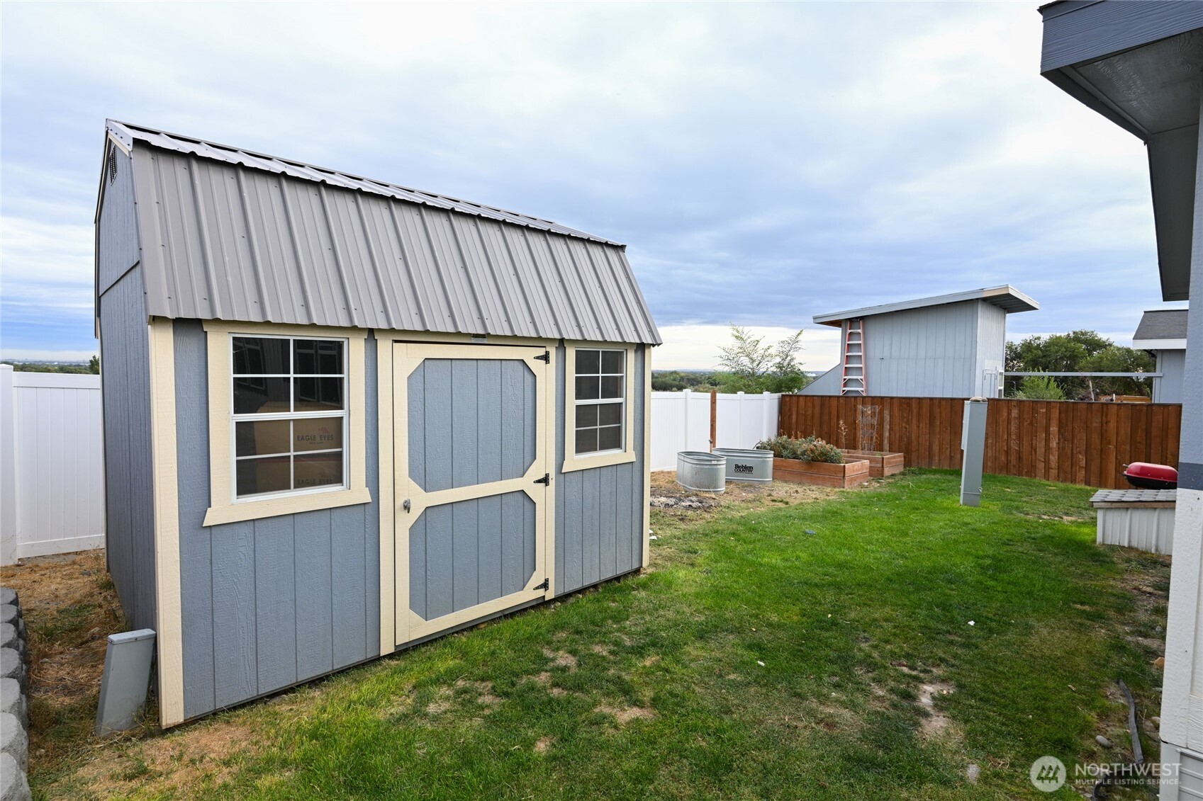 200802 East Game Farm Road, Unit 52 52 Kennewick, WA 99337 - Photo 2 of 12 a view of a house with a backyard