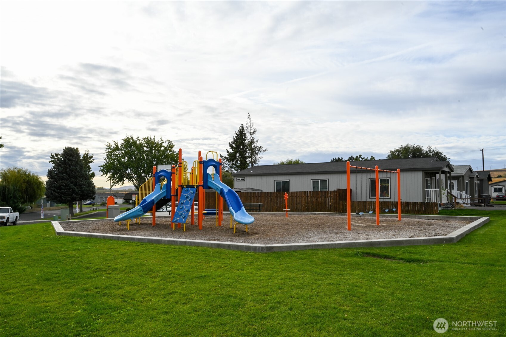200802 East Game Farm Road, Unit 52 52 Kennewick, WA 99337 - Photo 3 of 12 a view of a park with swings and slides