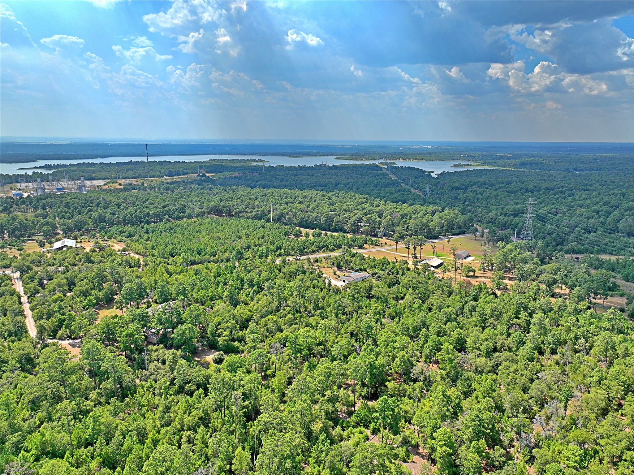 Tbd Pine Tree Loop Bastrop, TX 78602 - Photo 3 of 11 an aerial view of a houses with yard and mountain view in back