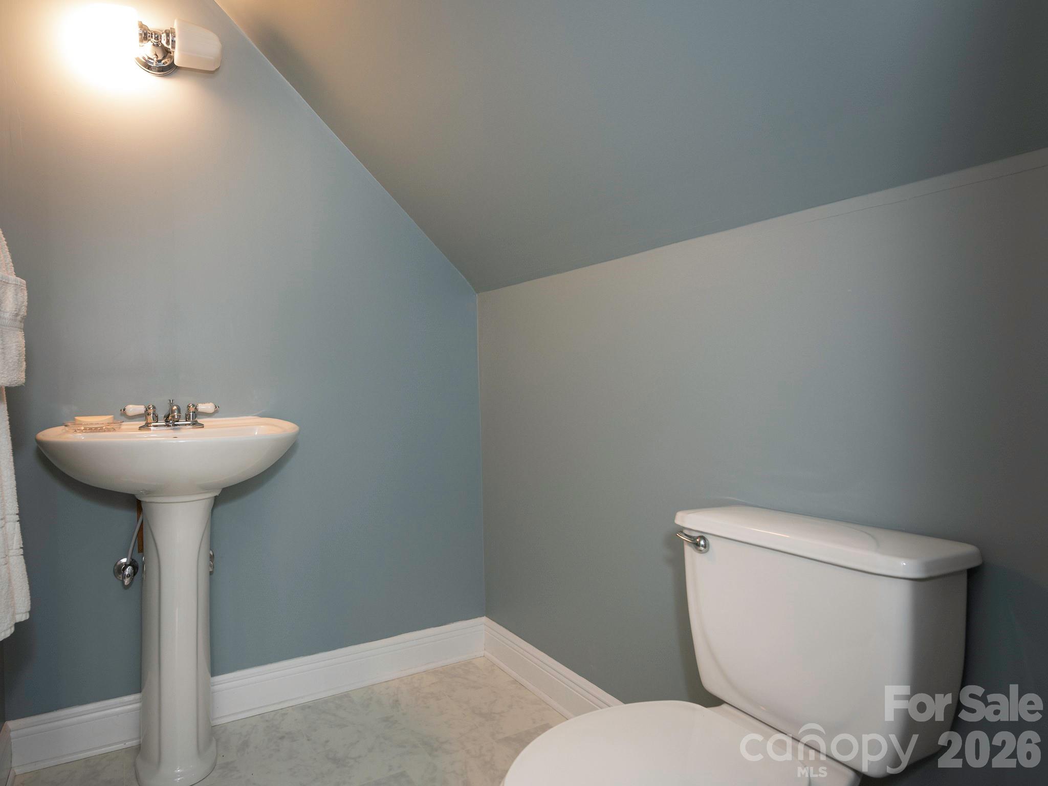 4440 Hucks Road Charlotte, NC 28269 - Photo 35 of 45 a bathroom with a toilet sink and mirror
