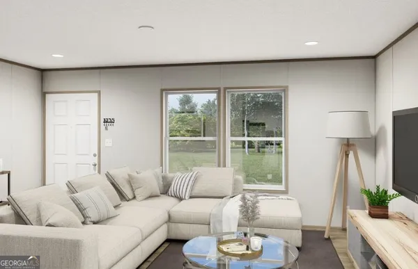 a living room with furniture and a large window