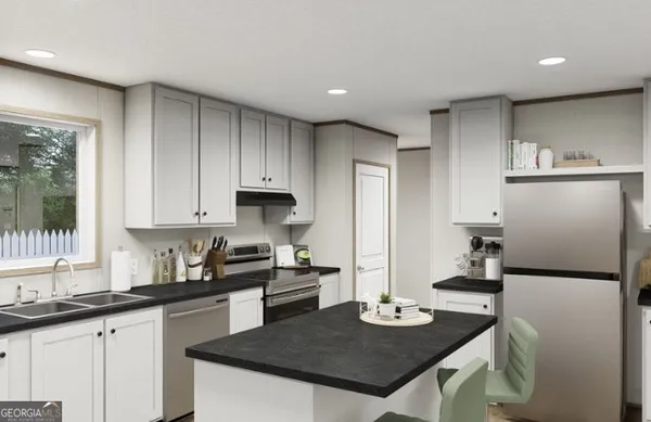 a kitchen with refrigerator and cabinets