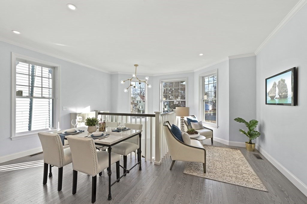 68 Edson Street, Unit 1 Boston, MA 02124 - Photo 10 of 23 a view of a dining room with furniture window and wooden floor