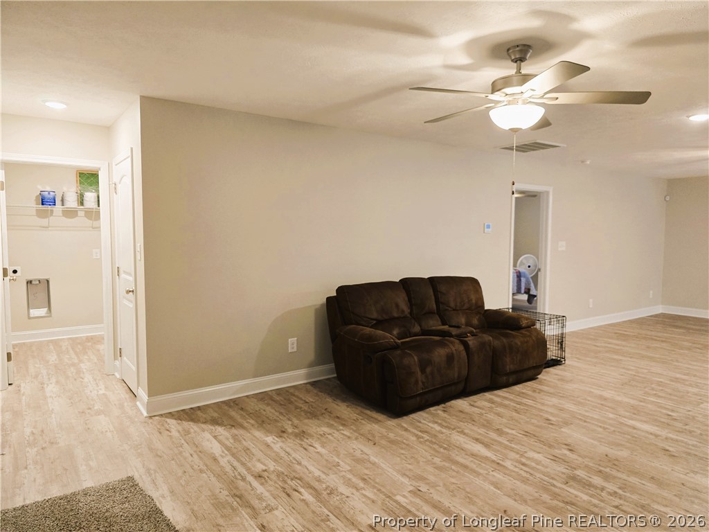 422 Mitchell Farm Road Goldsboro, NC 27530 - Photo 16 of 28 a living room with furniture and a chandelier