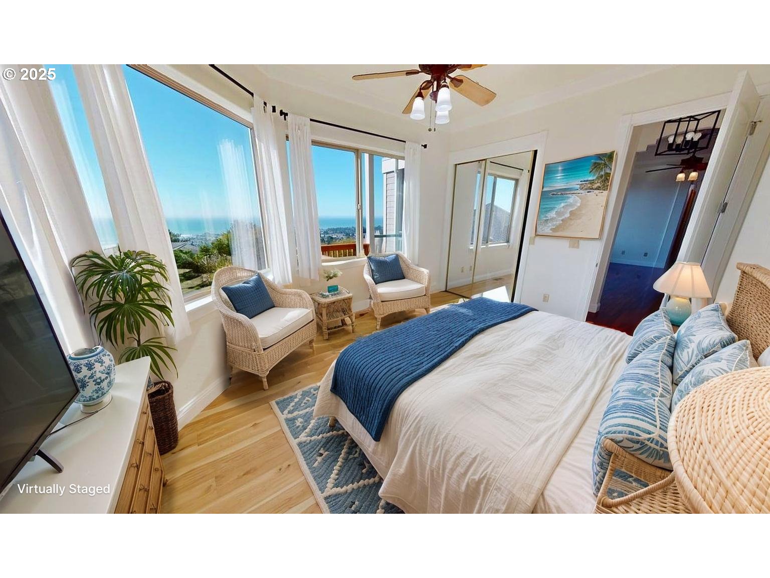 16898 Crown Terrace Brookings, OR 97415 - Photo 22 of 42 a spacious bedroom with a bed a couch and dresser