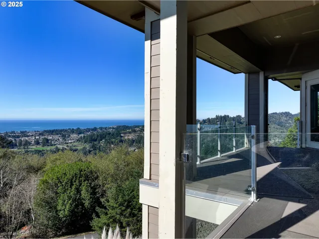 a view of a balcony with lake view and a floor to ceiling window
