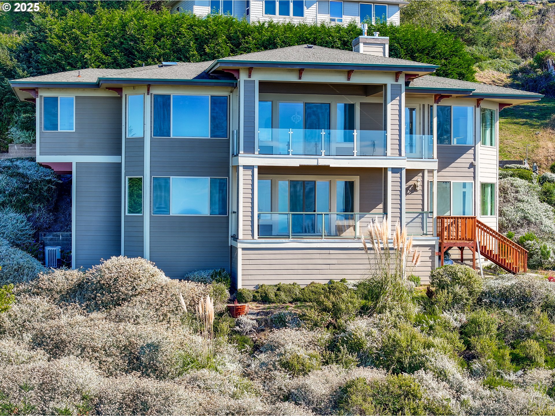 16898 Crown Terrace Brookings, OR 97415 - Photo 38 of 42 a front view of a house with garden