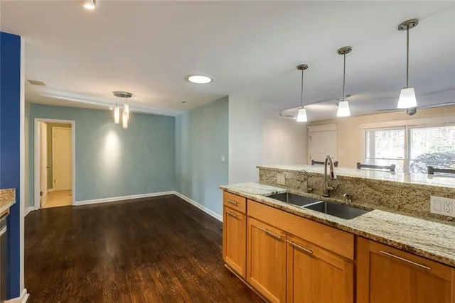 a kitchen with sink and window