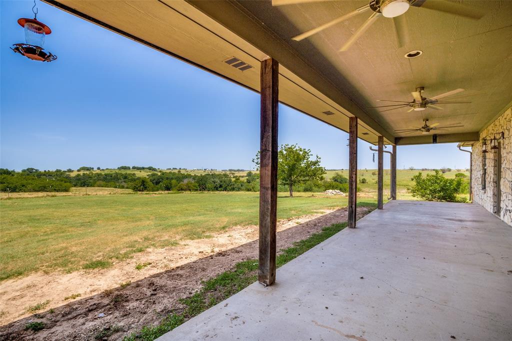 243 ROCK Court Decatur, TX 76234 - Photo 15 of 25 Expansive covered patio with concrete flooring