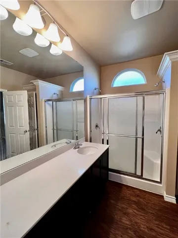 a bathroom with a sink and a mirror