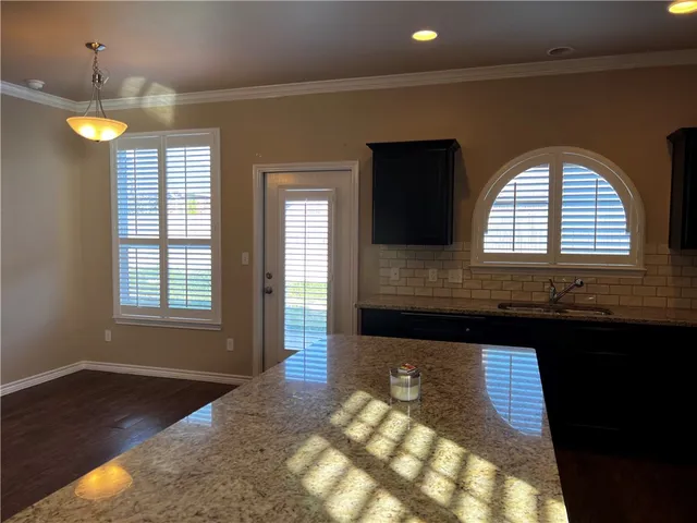 a view of entryway and hall with a window