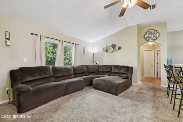 a living room with furniture and a window