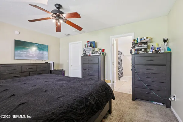 a bed room with a bed and a television