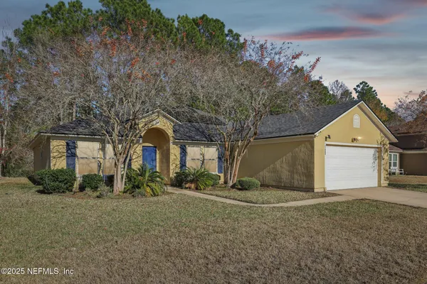 a front view of a house with a yard