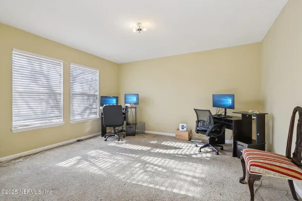 a workspace with furniture and a window