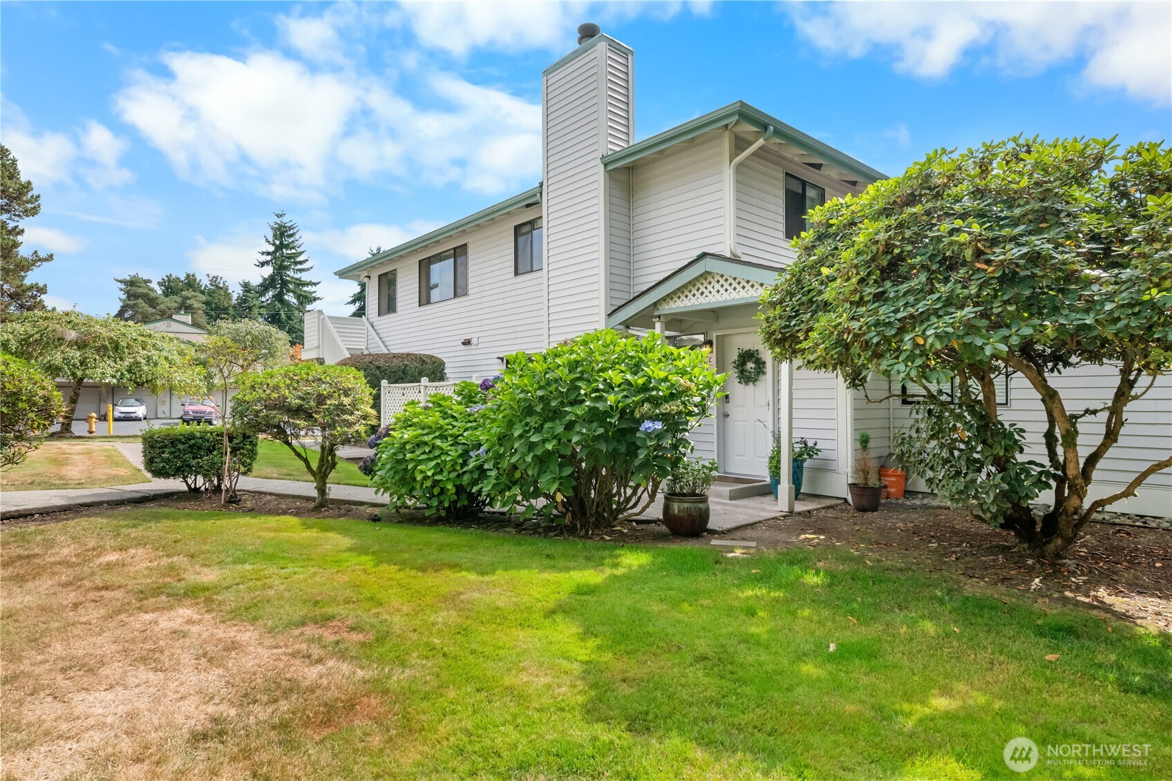1529 201st Place Southeast, Unit 12C Bothell, WA 98012 - Photo 1 of 27 a view of a backyard with a garden