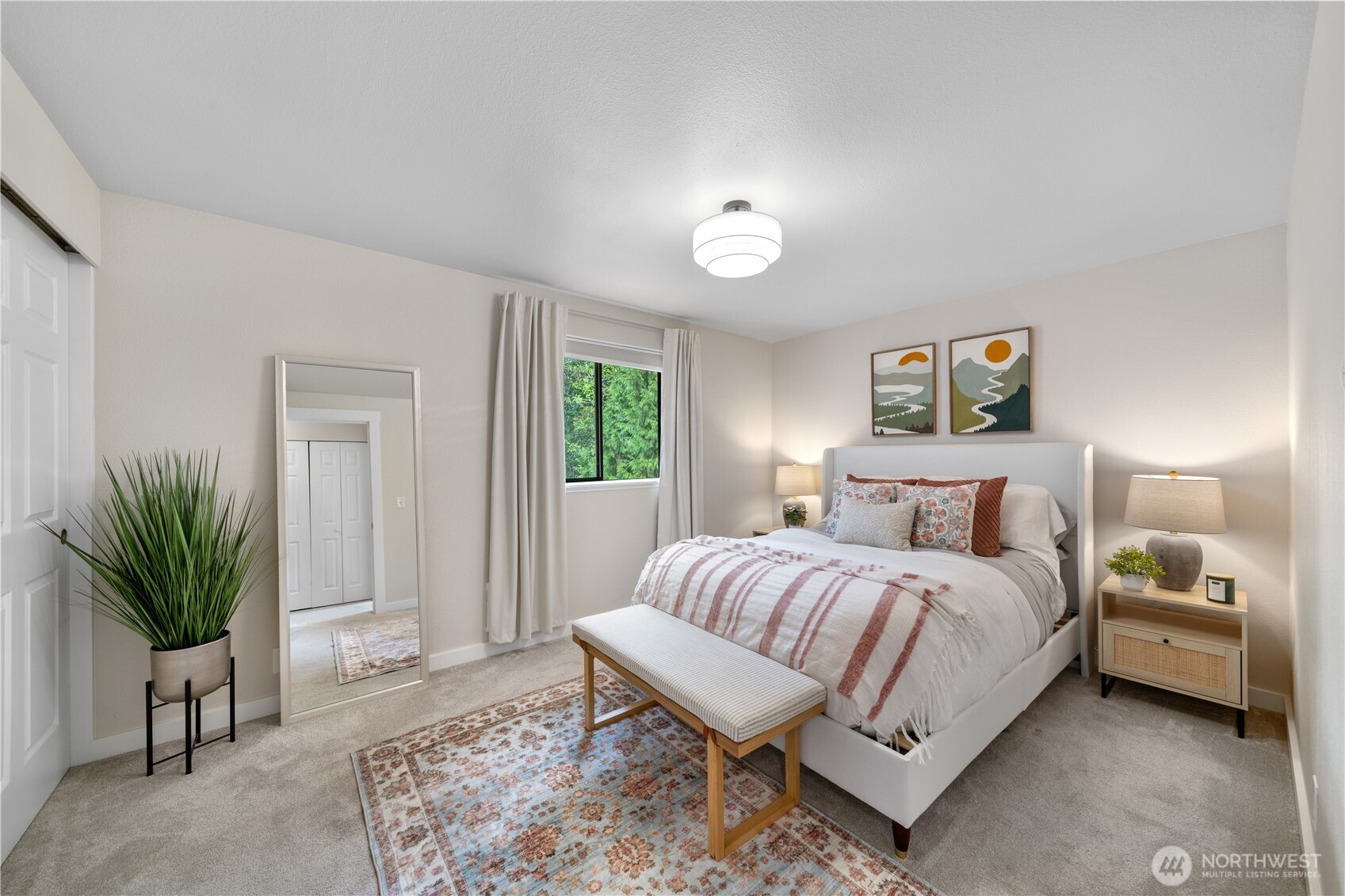 1529 201st Place Southeast, Unit 12C Bothell, WA 98012 - Photo 14 of 27 a bedroom with a bed and a potted plant