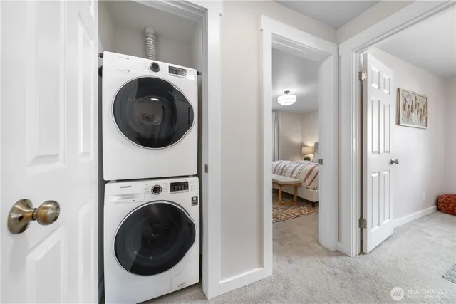 a view of a hallway with washer and dryer