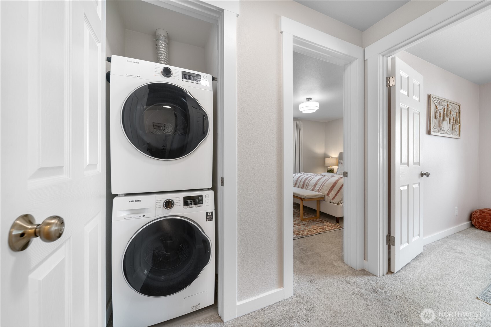 1529 201st Place Southeast, Unit 12C Bothell, WA 98012 - Photo 16 of 27 a view of a hallway with washer and dryer