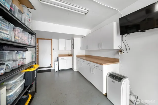 a kitchen with stainless steel appliances a stove a sink and a refrigerator