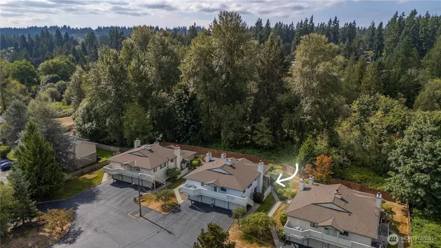 an aerial view of a house with yard swimming pool and outdoor seating