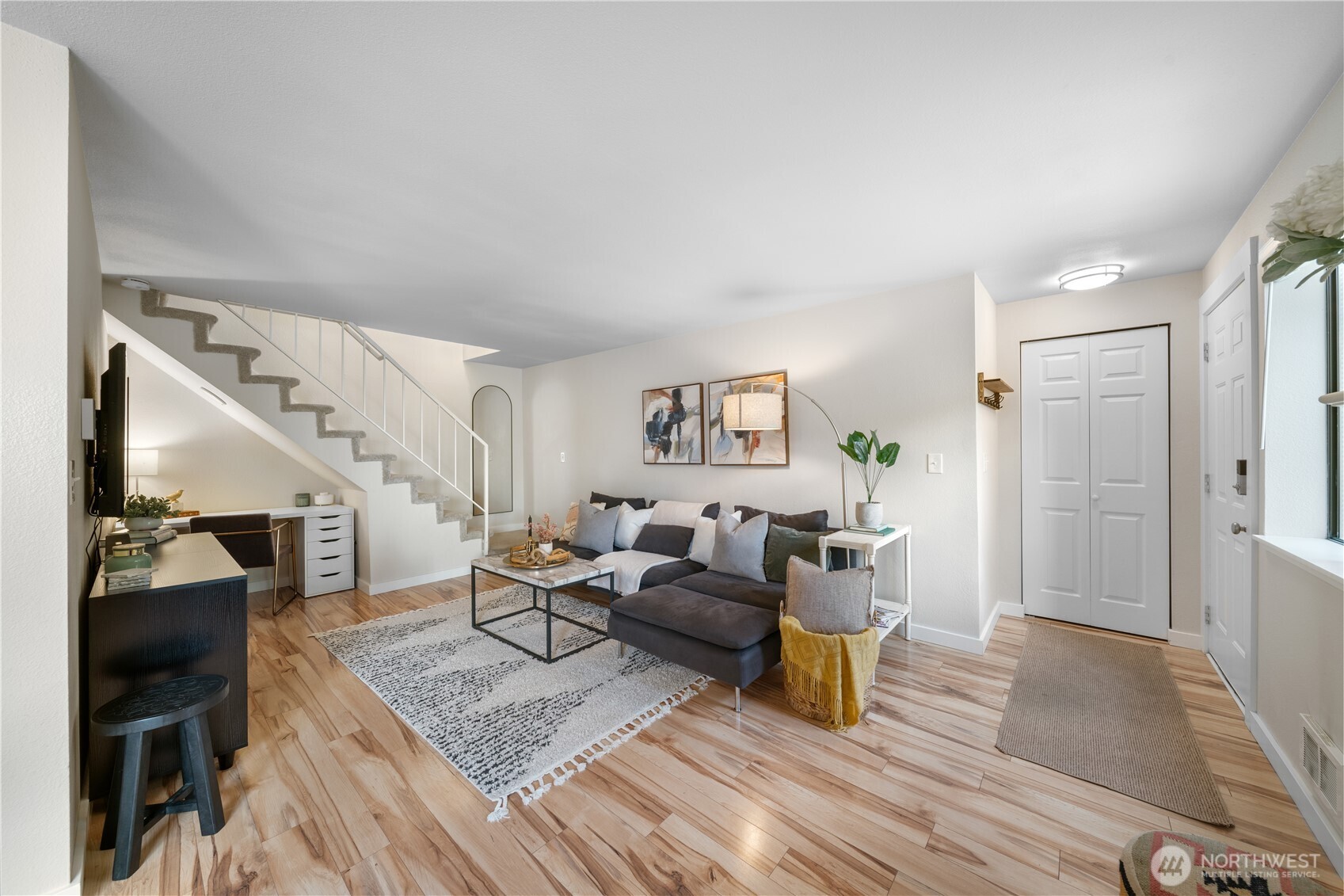1529 201st Place Southeast, Unit 12C Bothell, WA 98012 - Photo 6 of 27 a living room with furniture and a wooden floor
