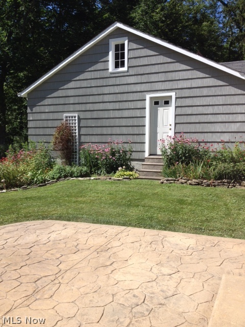1120 County Line Road Gates Mills, OH 44040 - Photo 18 of 21 Back patio of concrete and perennial garden