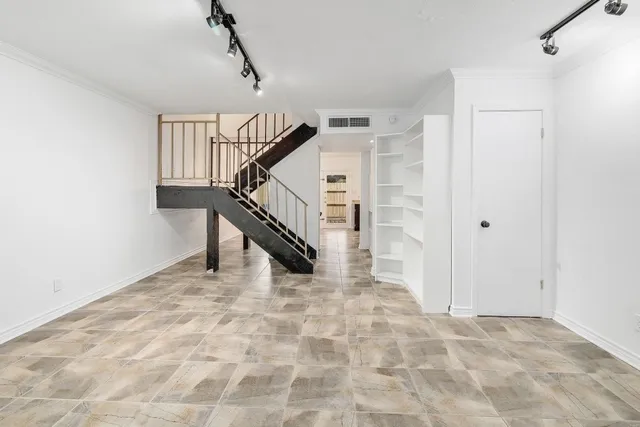 a view of kitchen with refrigerator stove microwave and cabinets