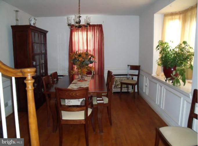 6147 Dunroming Road Baltimore, MD 21239 - Photo 5 of 10 a view of a room with furniture and wooden floor