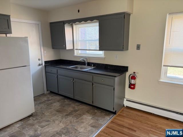 2 Rustic Circle, Unit A Montvale, NJ 07645 - Photo 3 of 7 a kitchen with a sink cabinets and wooden floor